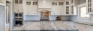 A kitchen with granite countertops