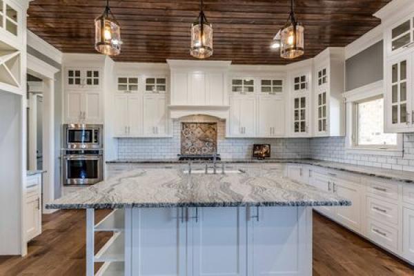 A kitchen with granite countertops