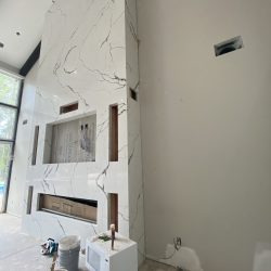 A floor to ceiling marble fireplace surround by MC Granite Countertops in Atlanta.